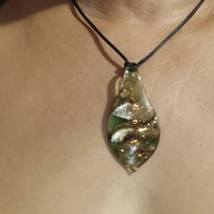 Glass and gold pendant with silk strand